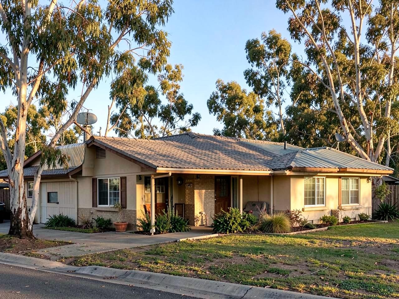 Concrete tile roof and rolled-roof addition on a Vista, CA home shaded by eucalyptus